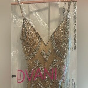 Rhinestone Jumpsuit
Long flowy rhinestone embroidery & mesh